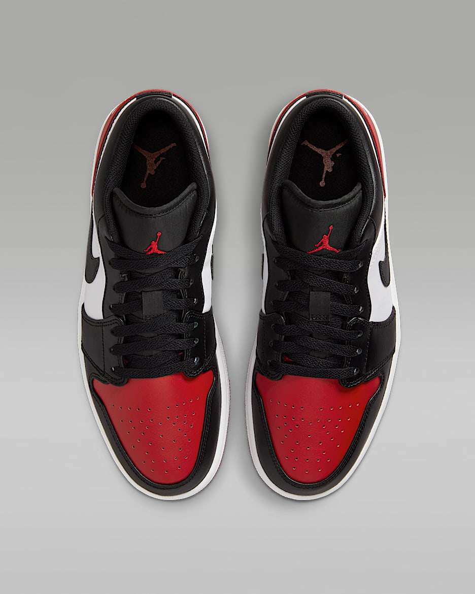 Black jordans with red logo store